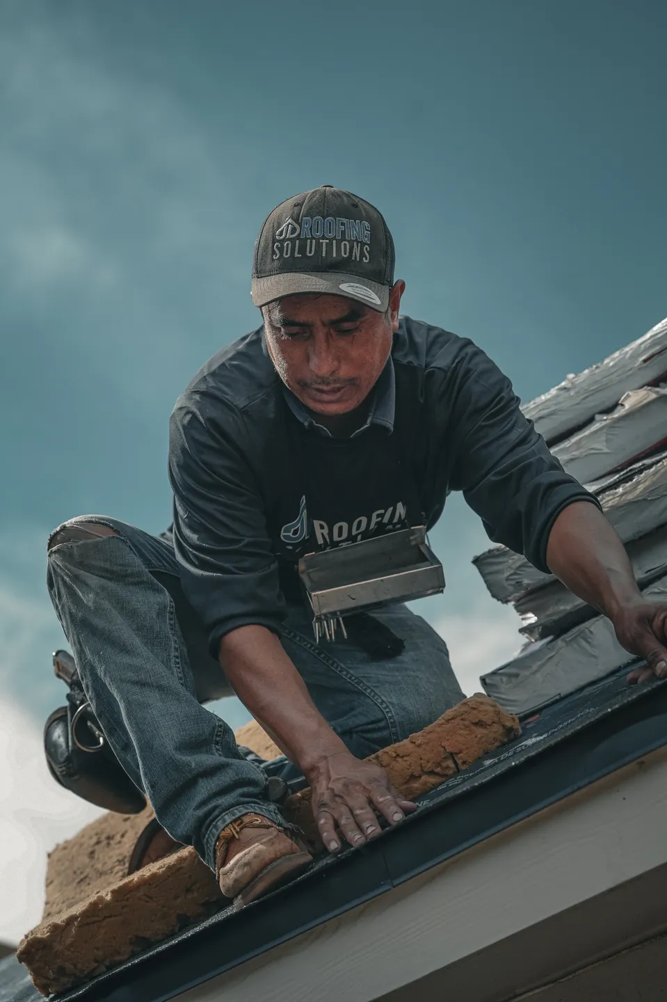 JD Roofing worker on job